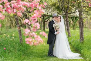 Emma and Tom take a stroll through the blossom at Hever Church