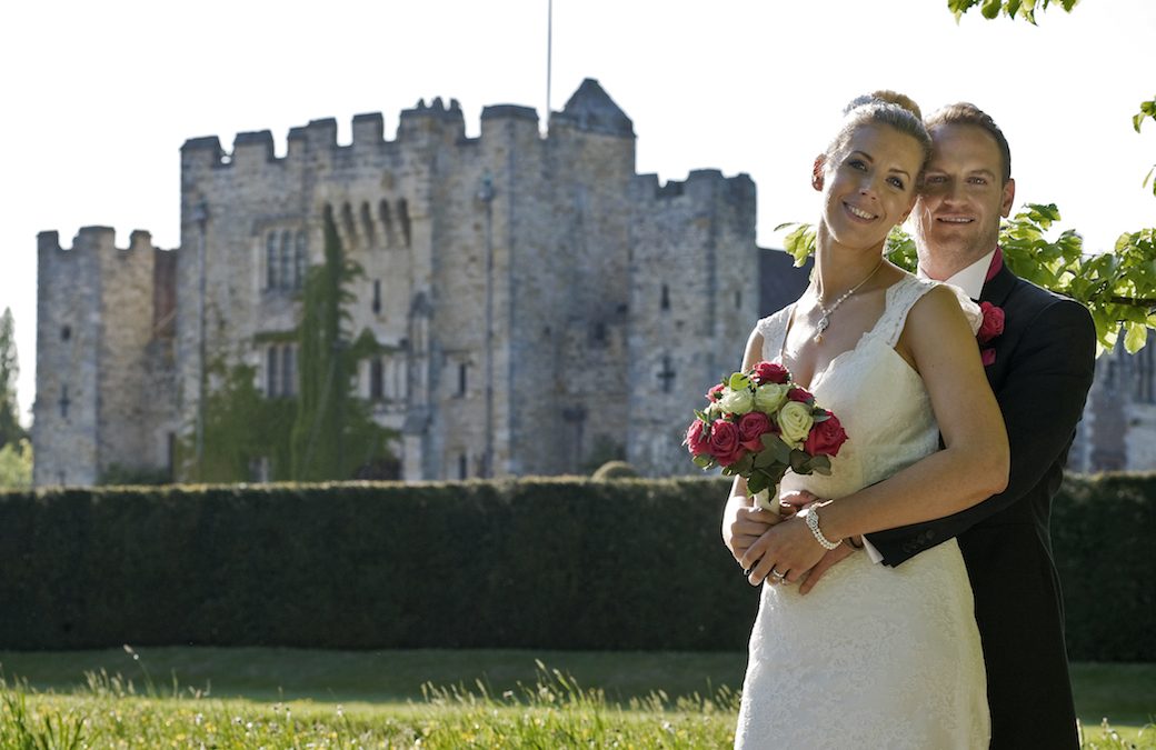 Rosalind & Stuart wedding photo posing in front of Hever Castle